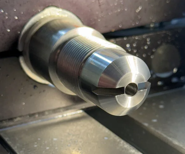 Close-up of a freshly machined, threaded barrel shank
