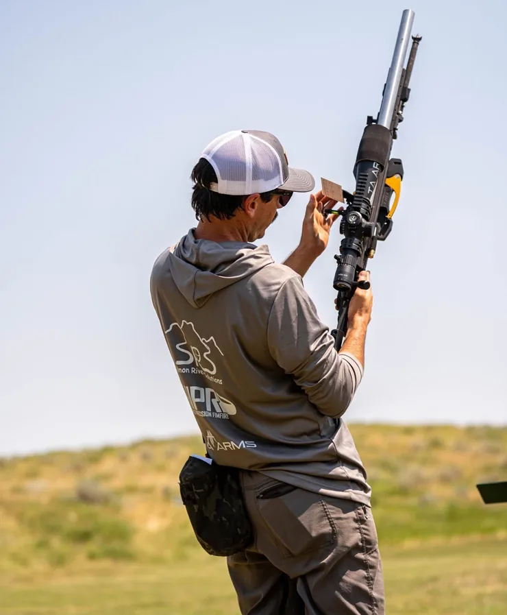 Shooter checking a rifle on the firing line
