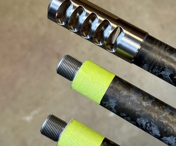 Threaded carbon fiber barrels with a muzzle brake